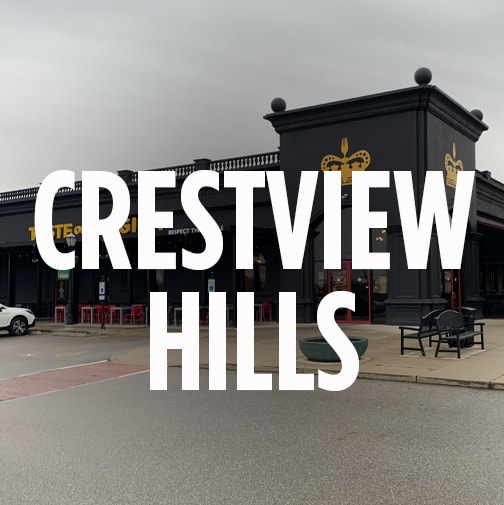 the storefront of taste of belgium's location in crestview hills, kentucky. The words "CRESTVIEW HILLS" is overlaid in bold white letters